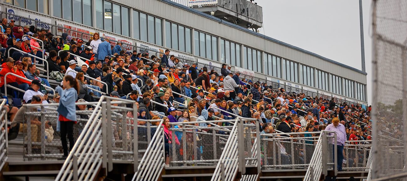 Article-Langley NASCAR Fans sitting in the grandstands